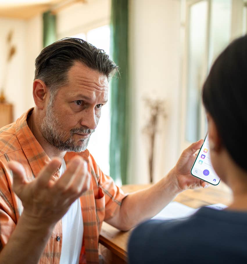 Man gestures to woman it is not his problam