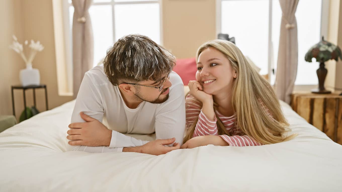 Man and his female friend sharing a bed