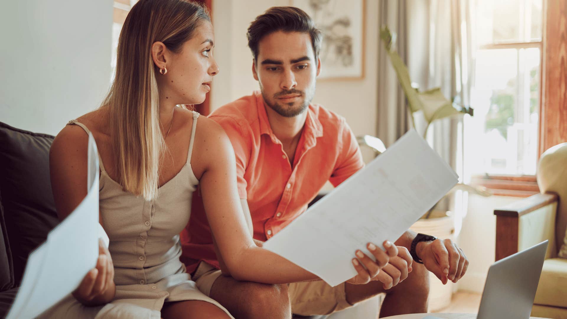 couple holding bills