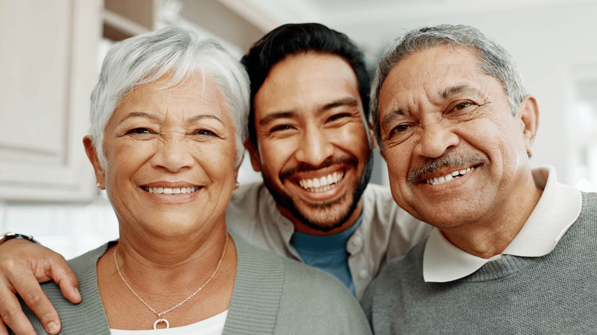 Millennial son takes selfie with homemade Boomer parents