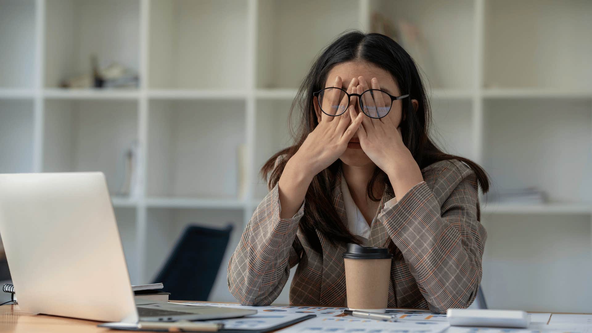 exhausted woman in front of computer