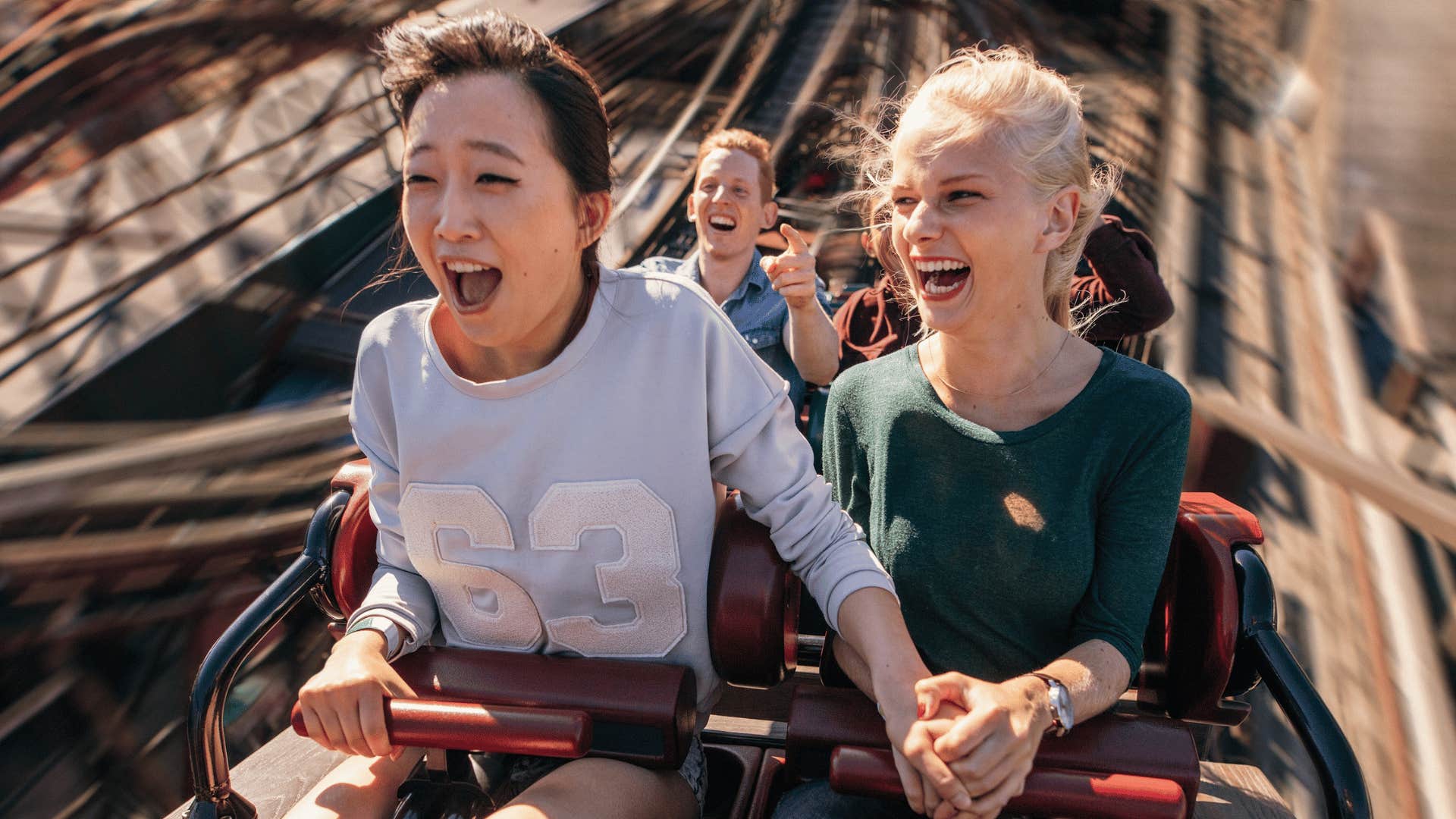 women on a rollercoaster