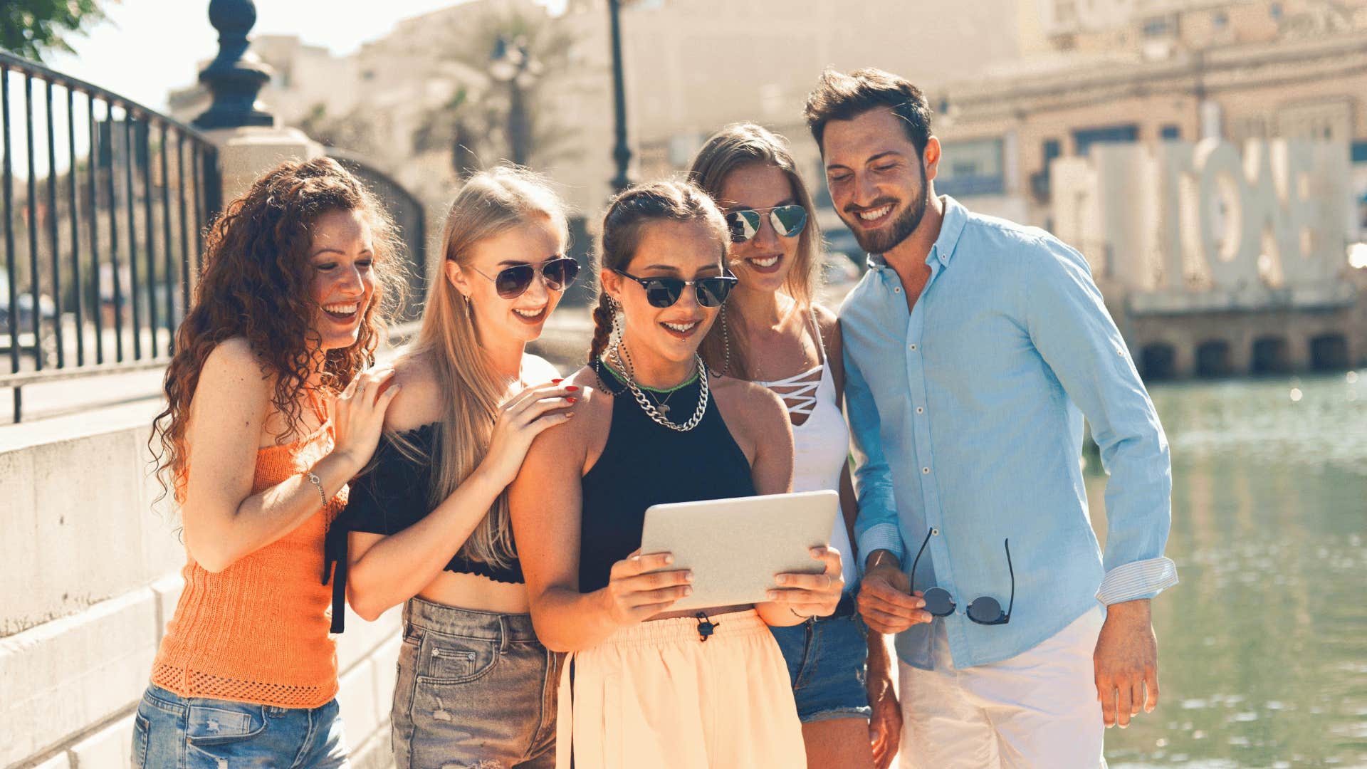 friends looking at a tablet