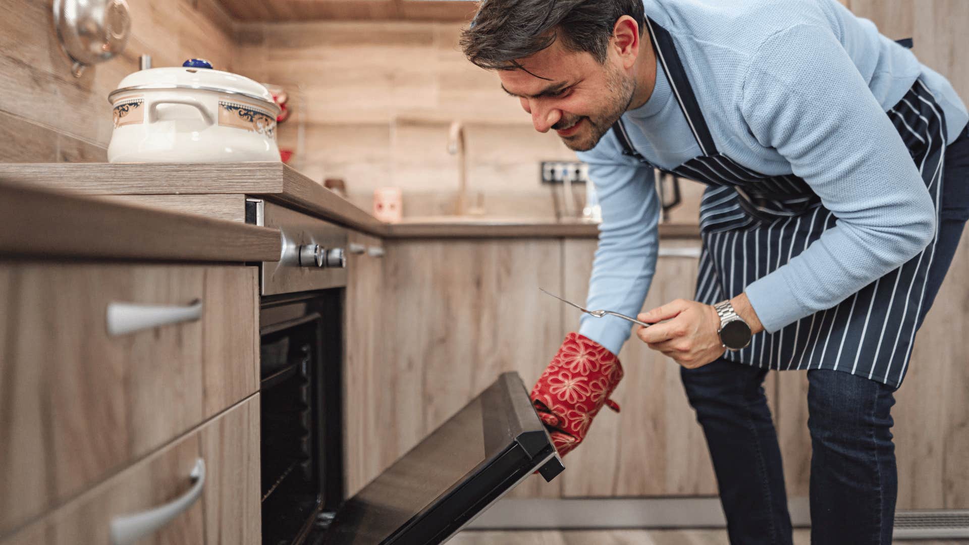 Man opening oven