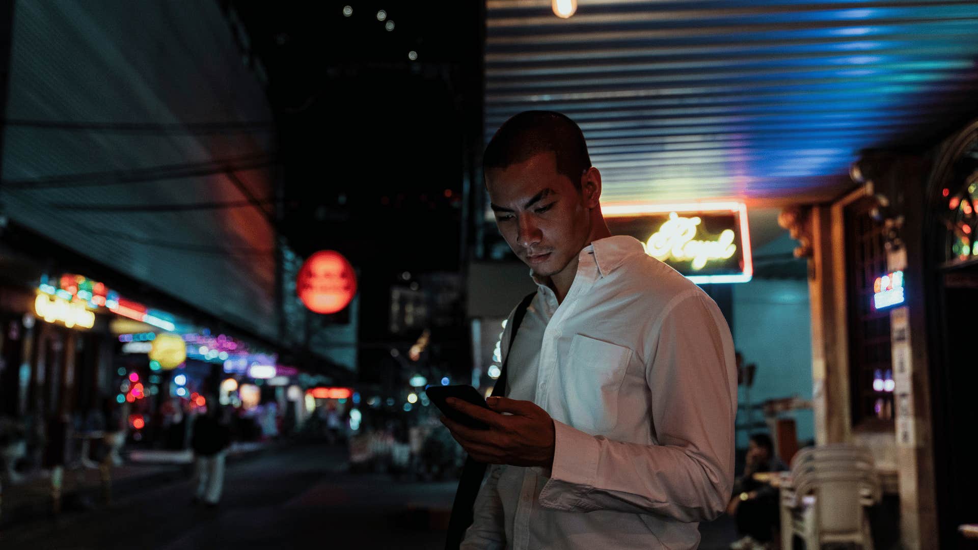 man on phone at bar