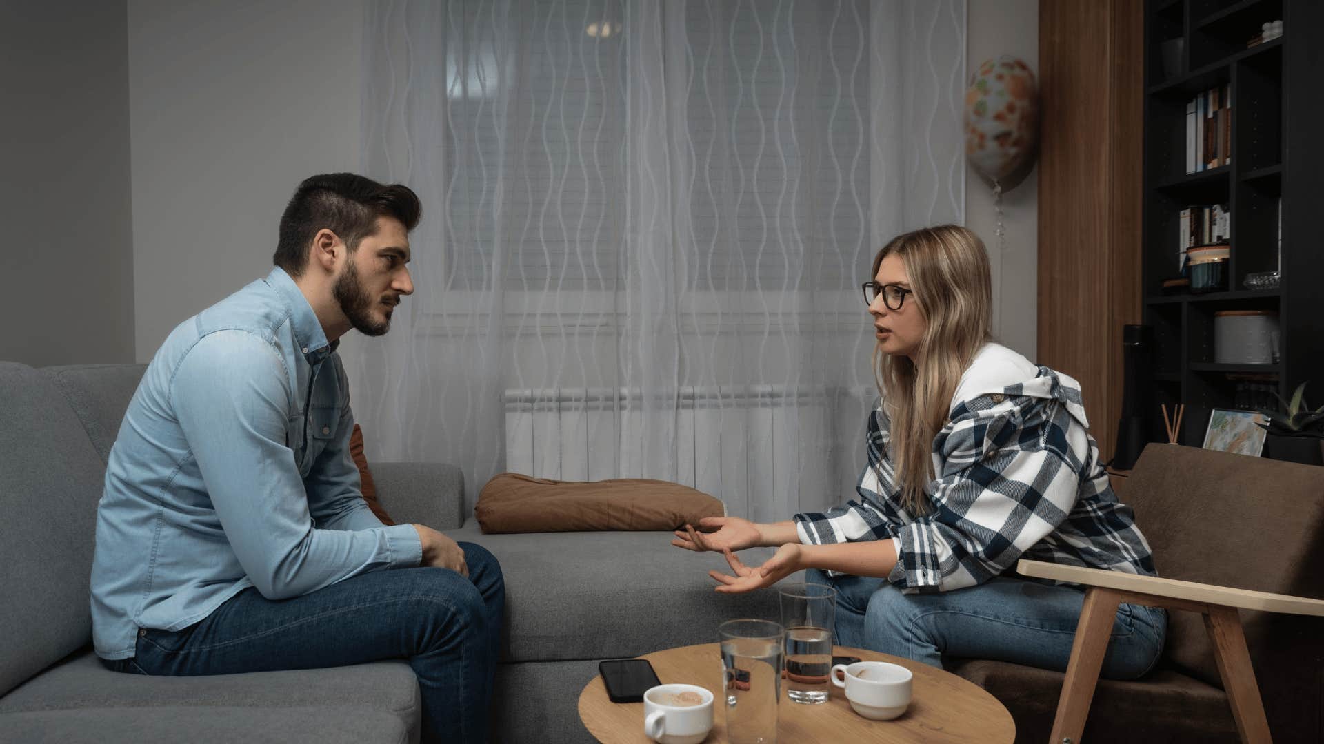 upset couple sitting across from each other