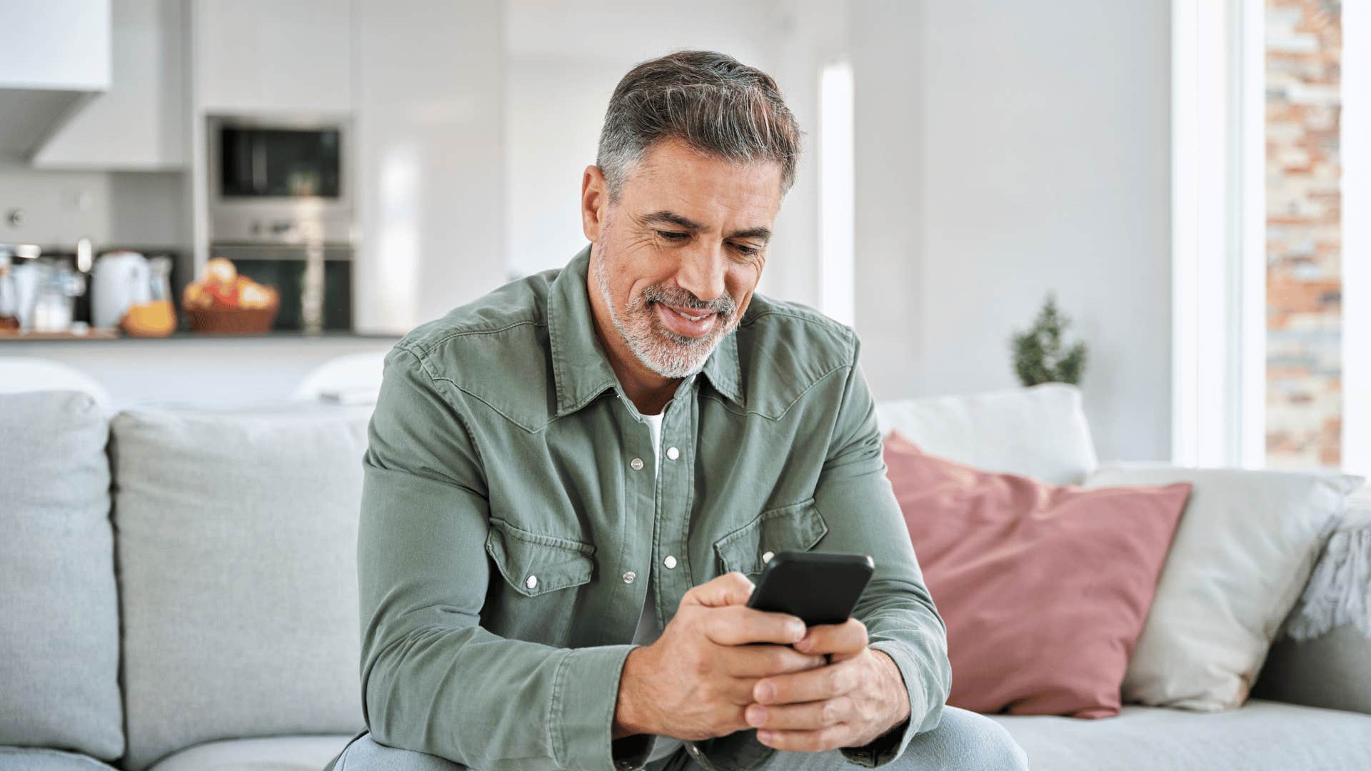 man texting on phone