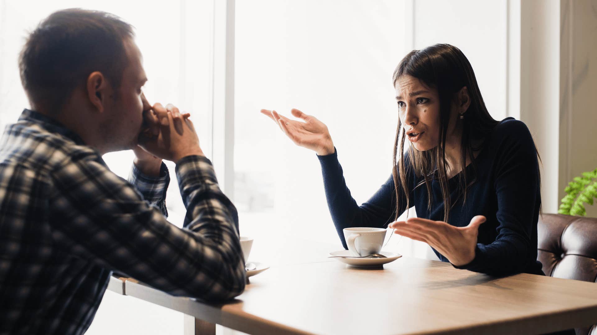 upset woman talking to man