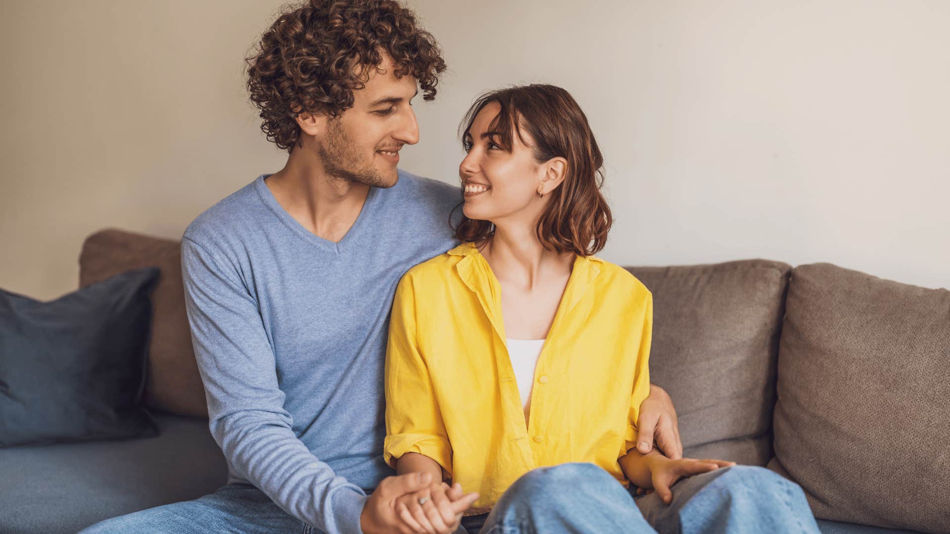 couple looking at each other on couch