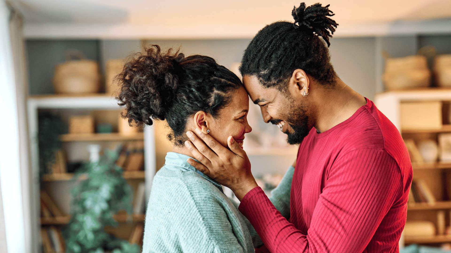 Forehead to forehead, a man and woman are satisfied in the relationship