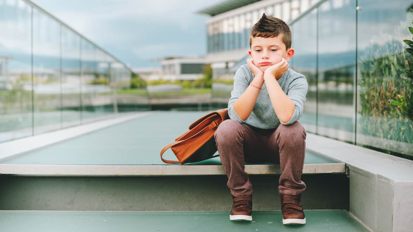 Son waiting at school for his parents