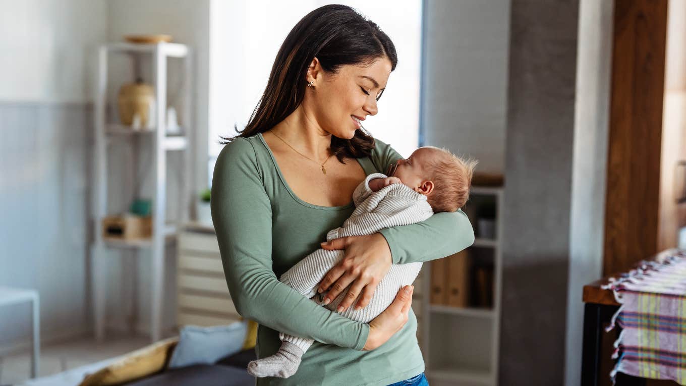 Mom holding her newborn baby with an unconventional name