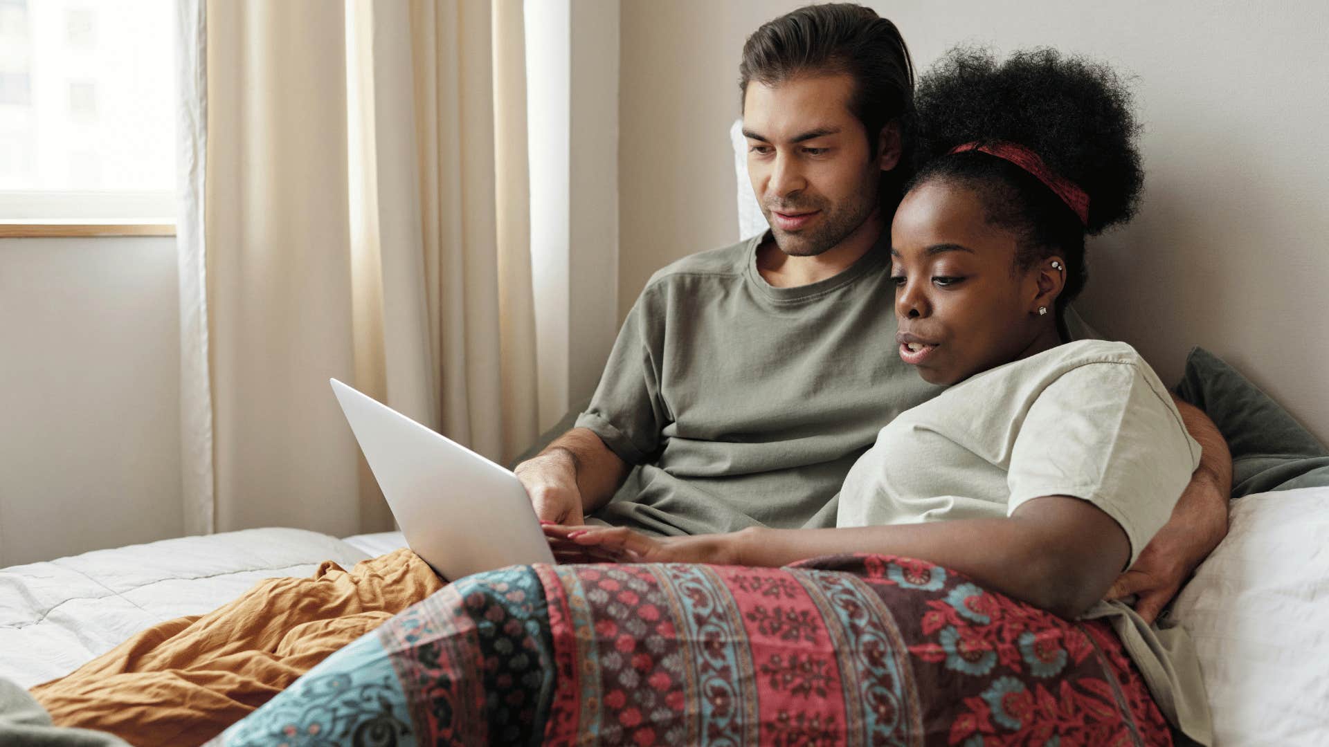 couple in bed reading together