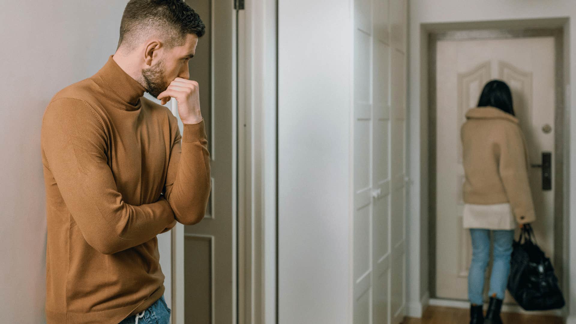 woman walking out of apartment