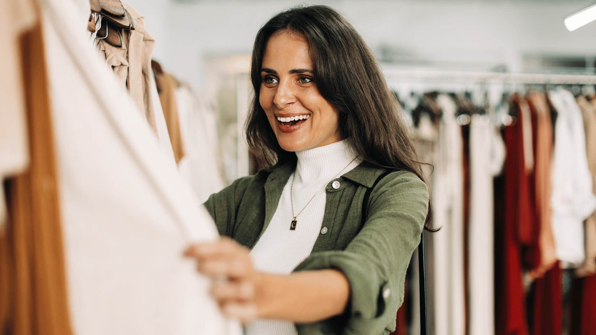 woman looking through outfits 