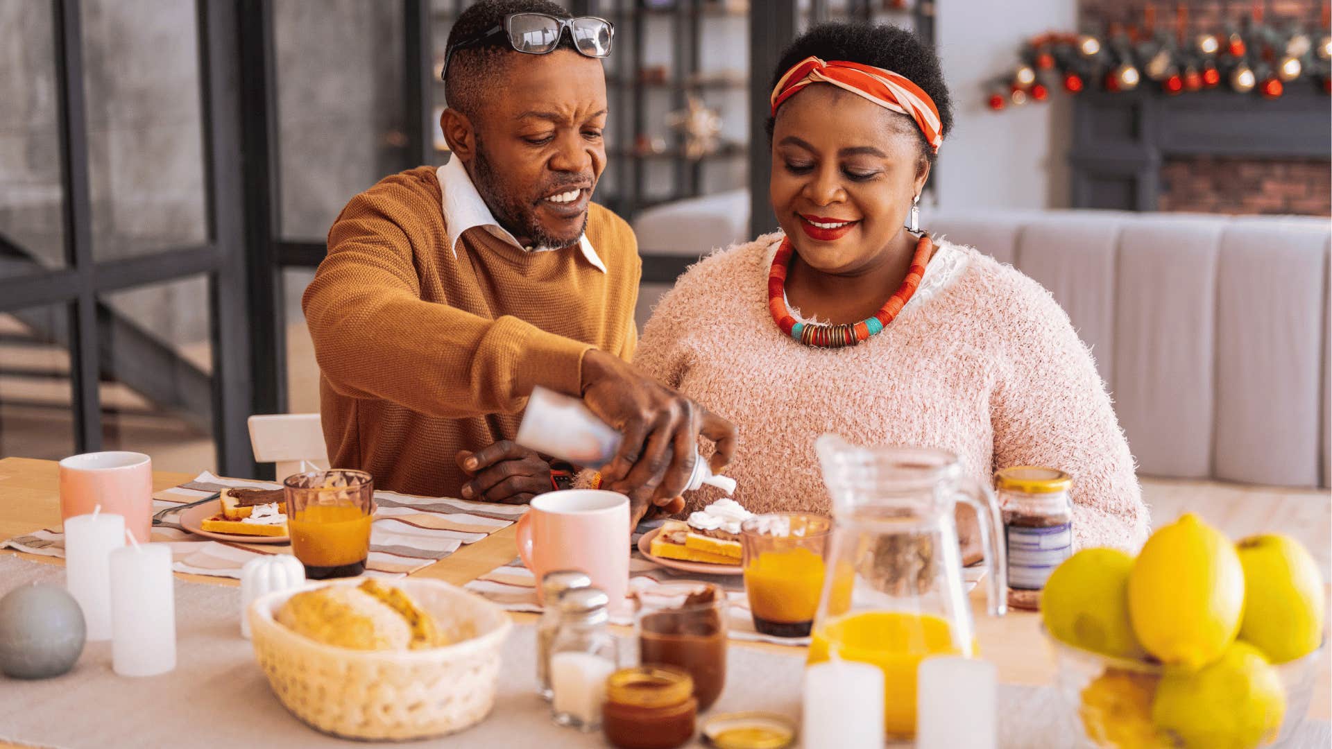 Happy couple have breakfast at home