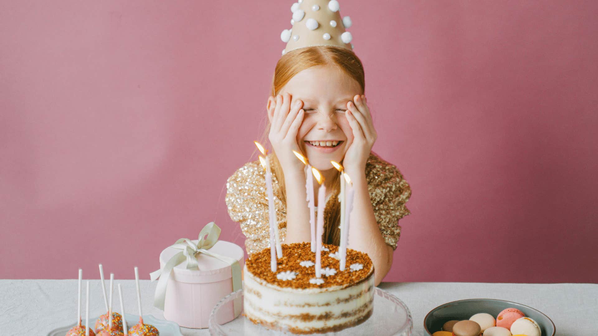 little girl with birthday cake and candles