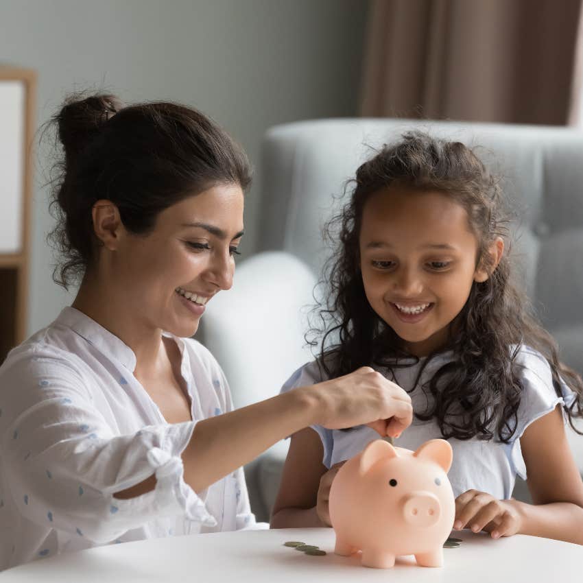 Parent teaching kid about budgeting by leading by example