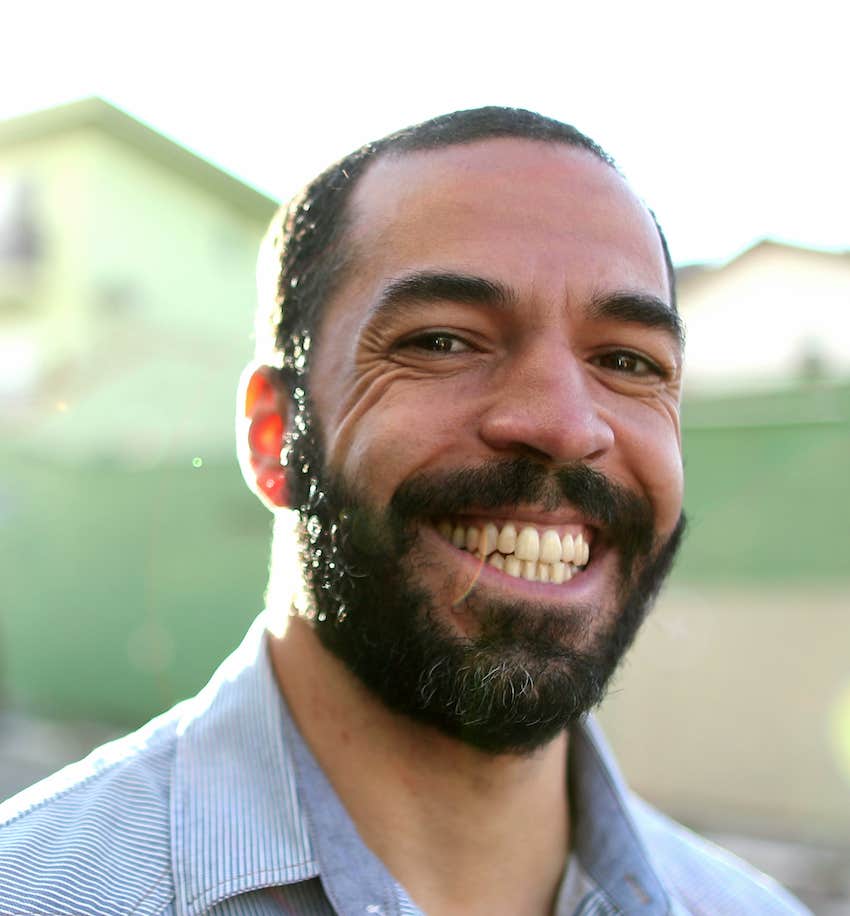 Naturally happy man smiling, being fully himself