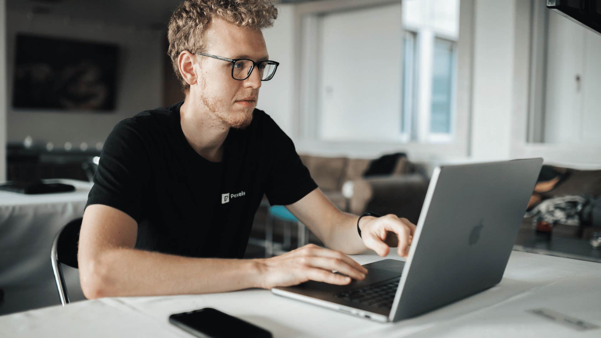 man working on laptop at home