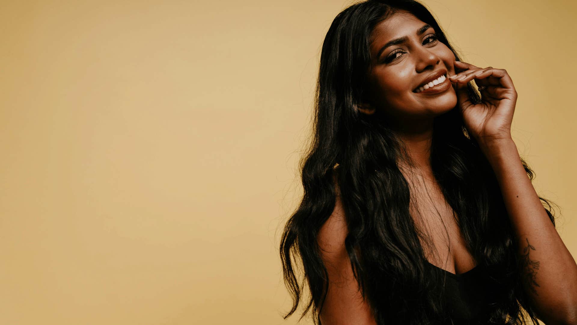 woman in a black shirt smiling