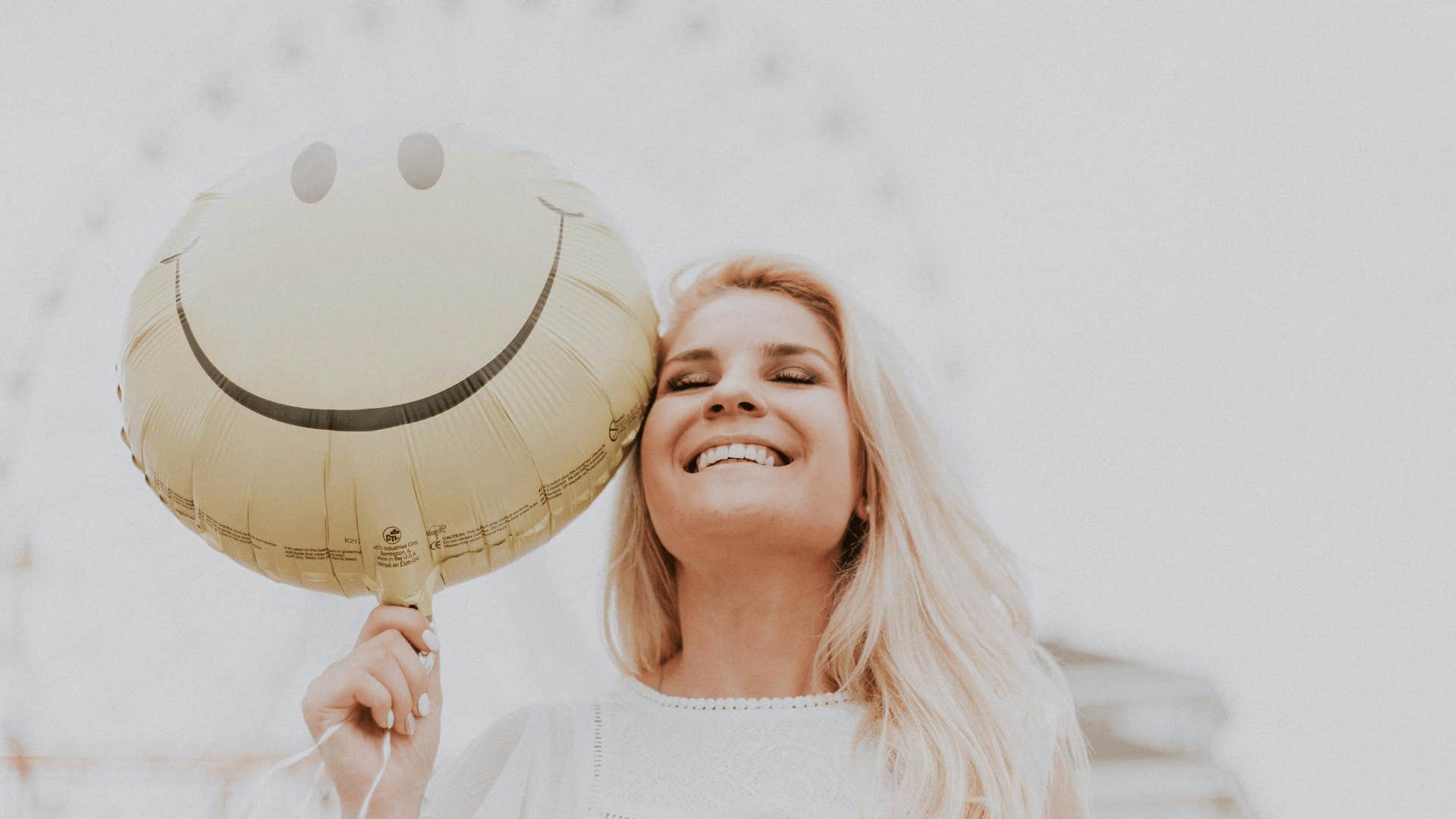 woman smiling with balloon