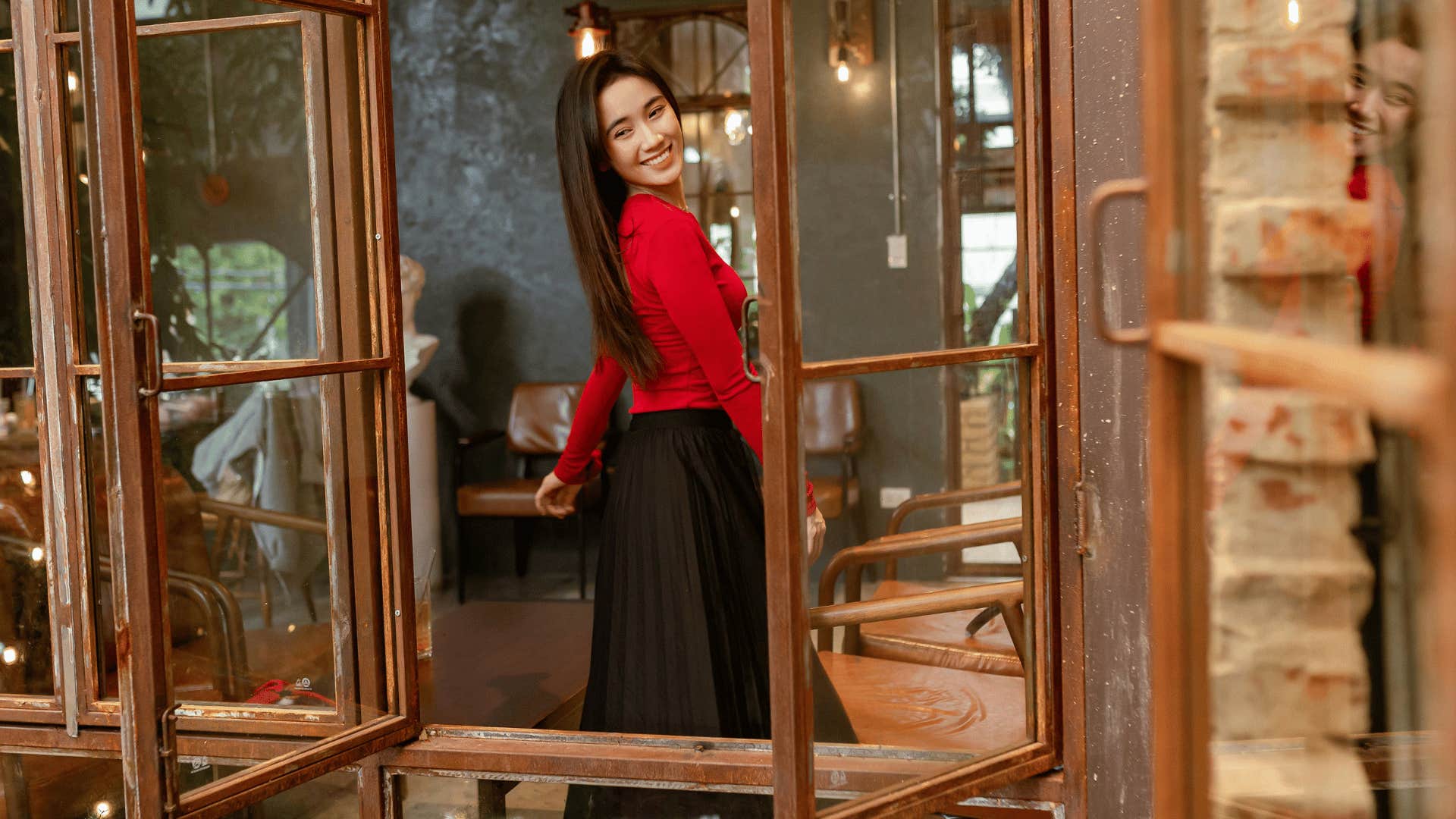 woman smiling in a cafe