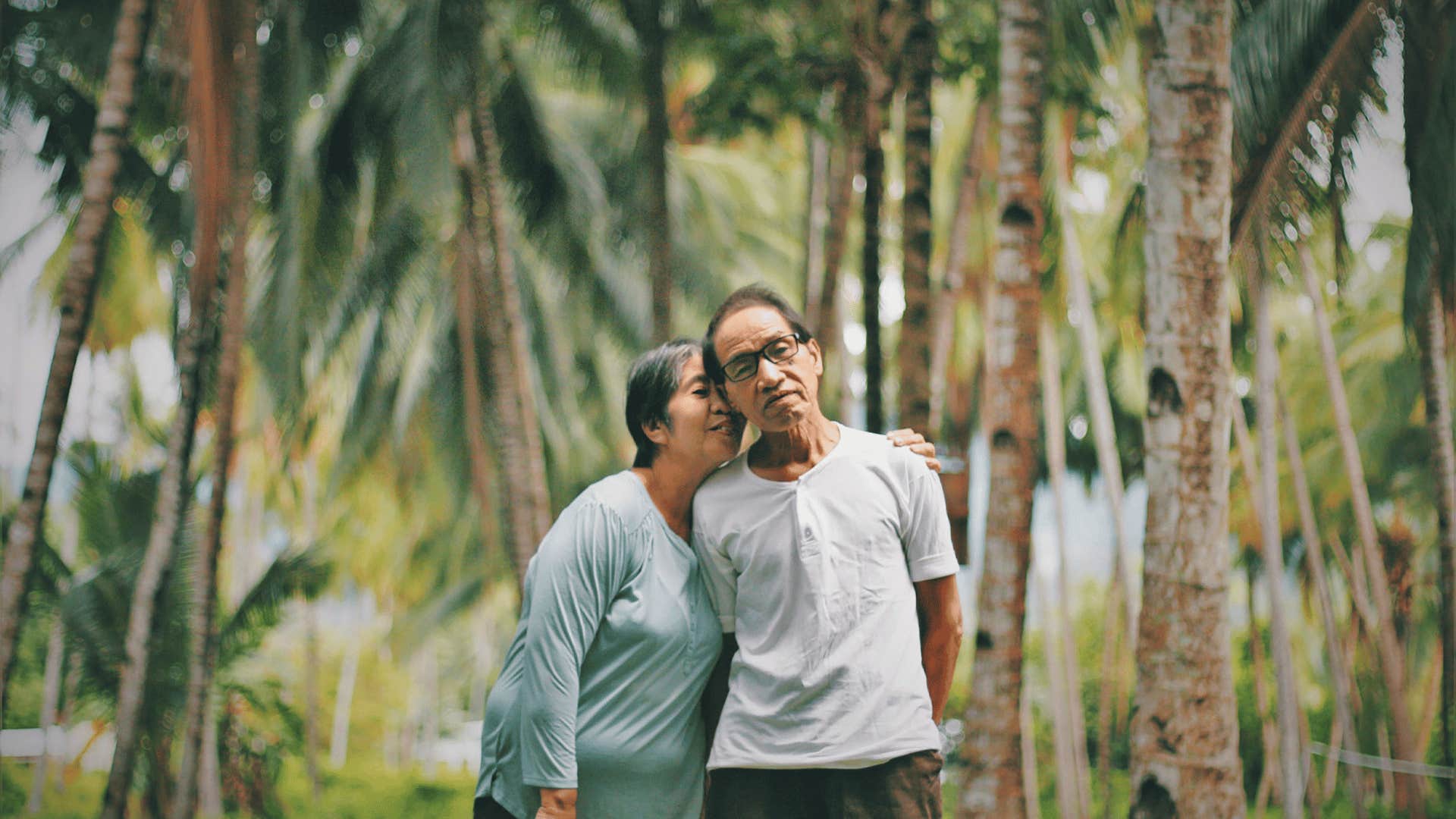 happy older couple in forest