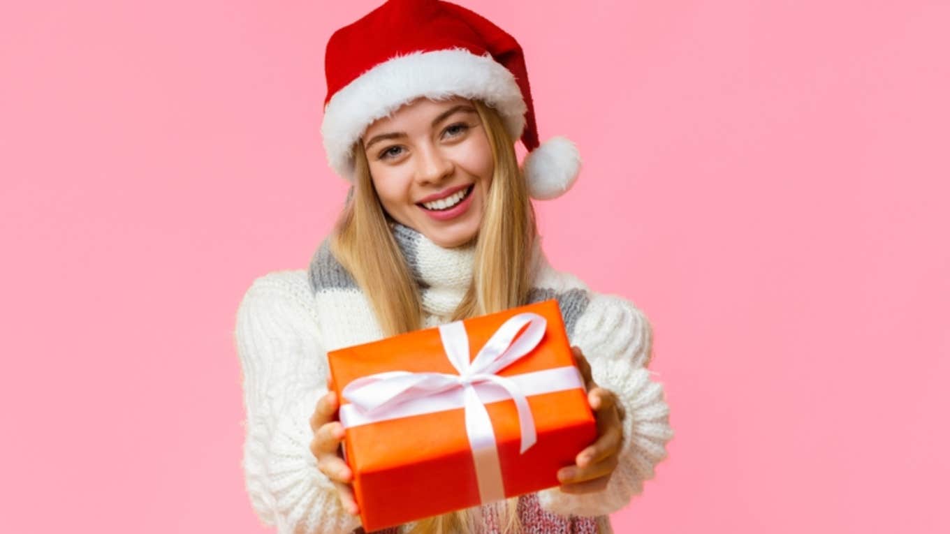 woman holding christmas gift 