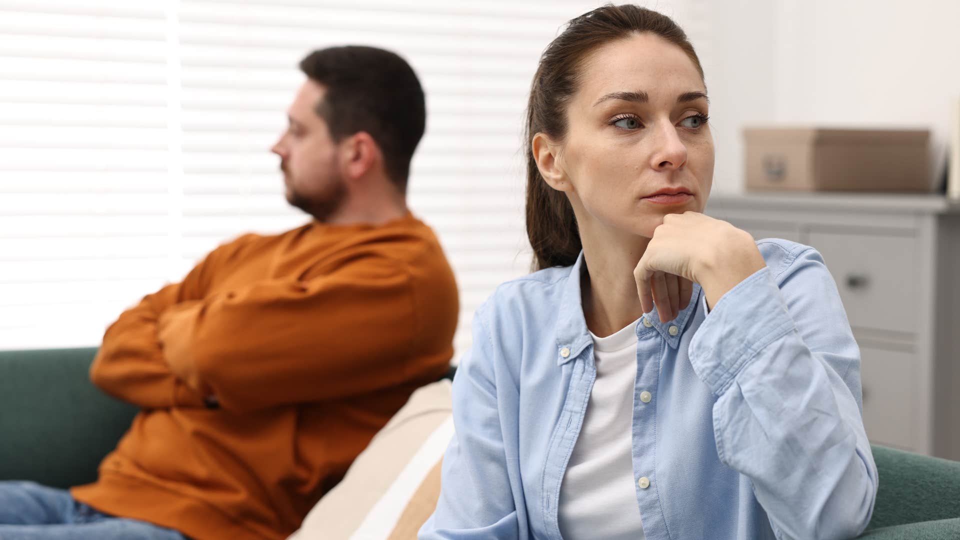 Woman looking annoyed turned away from her partner