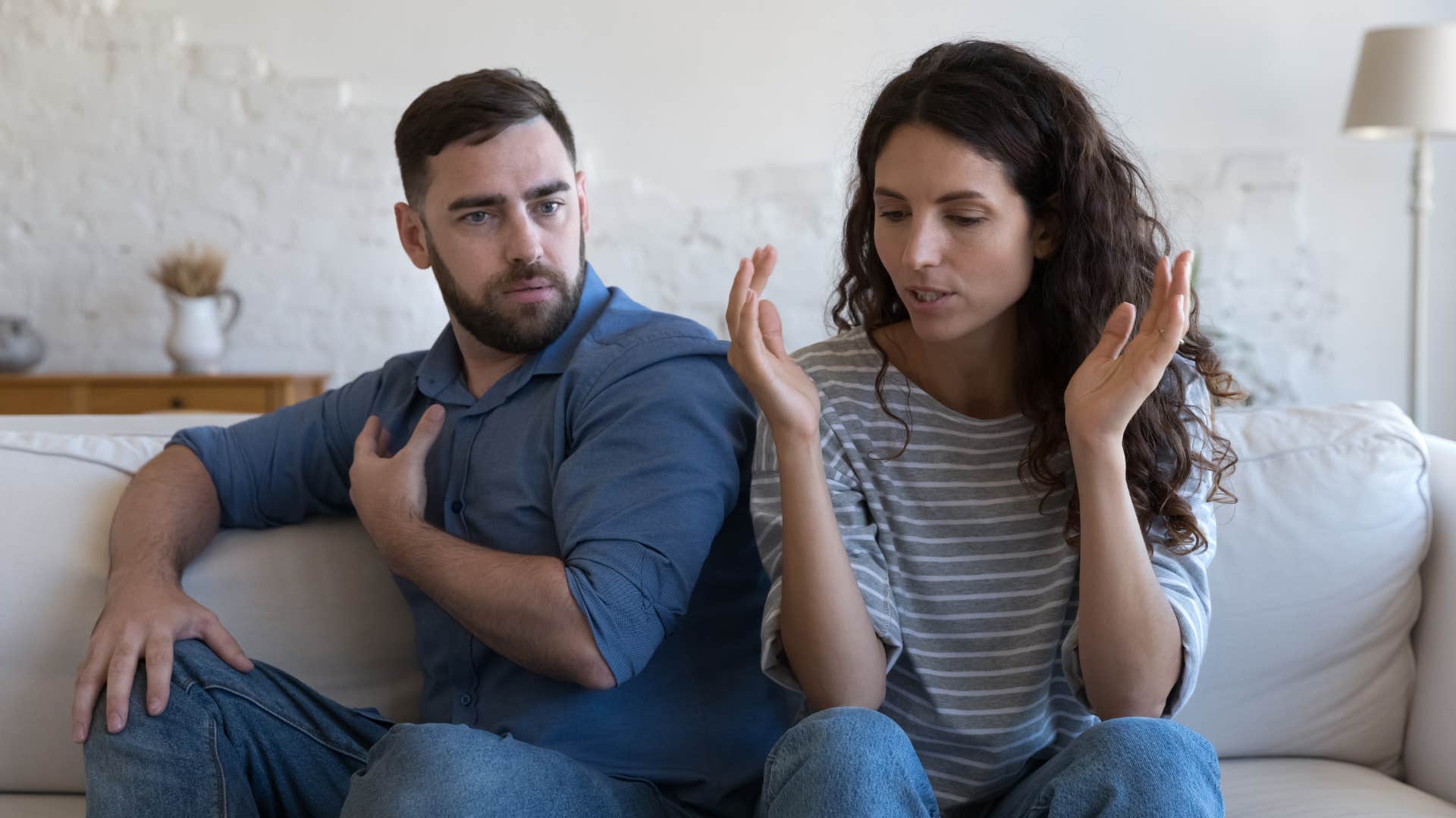 Woman looking annoyed next to her husband