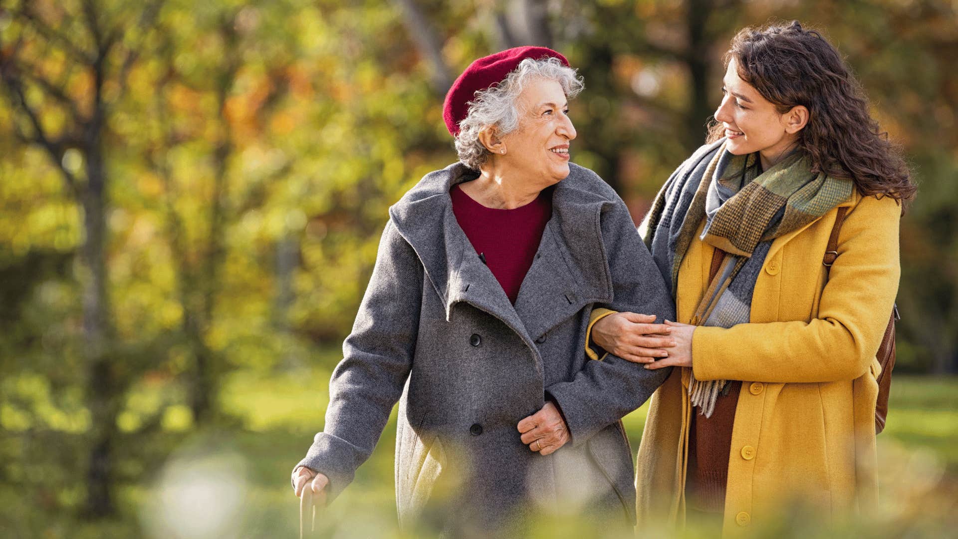 older woman and younger woman walking together