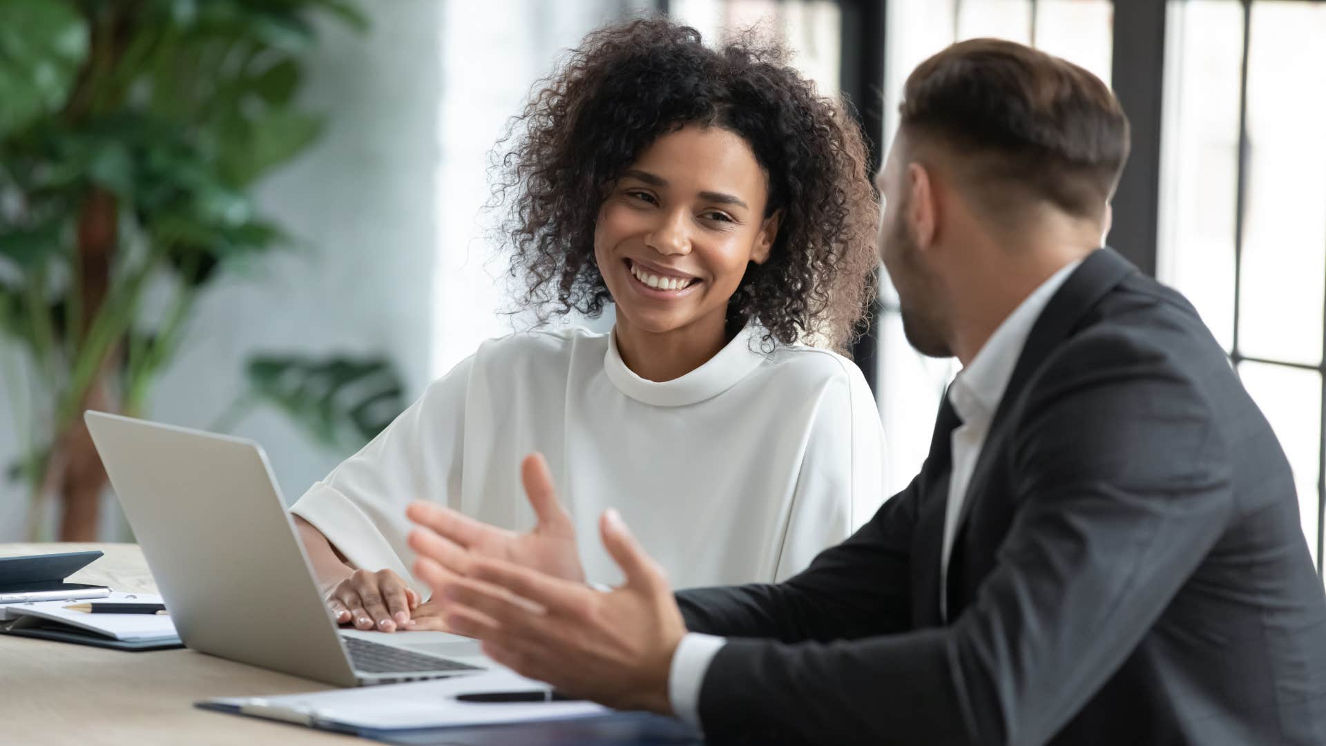 Woman talking to her peer at work