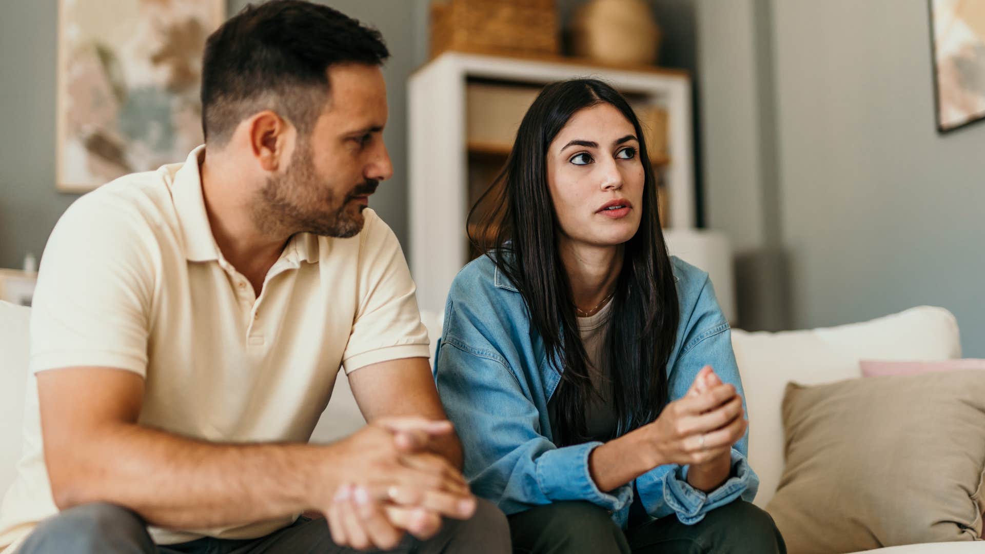 Couple sitting on the couch talking