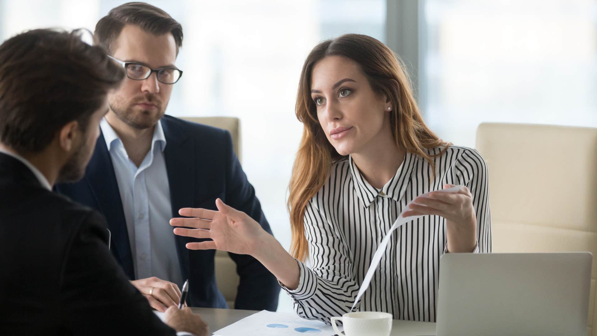 Professional woman arguing with a man.