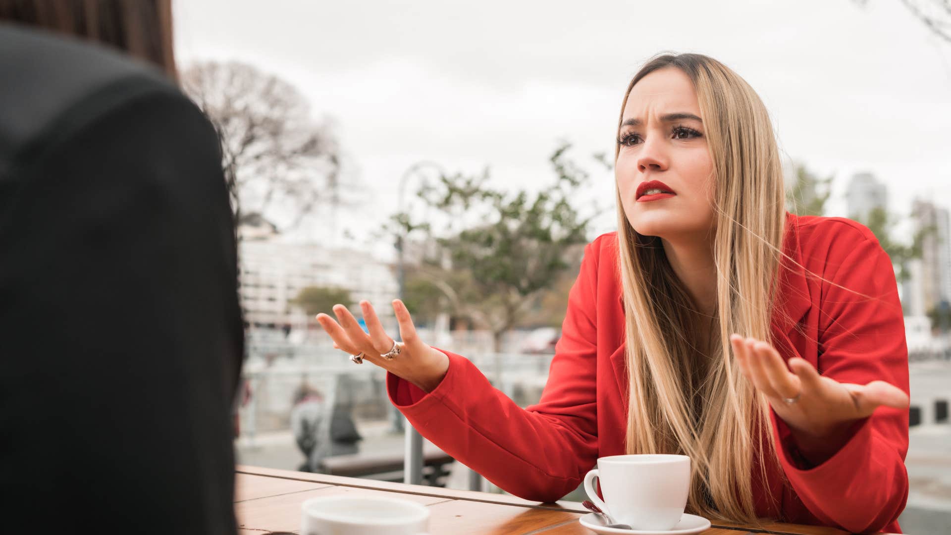 Woman looking annoyed staring at her friend.