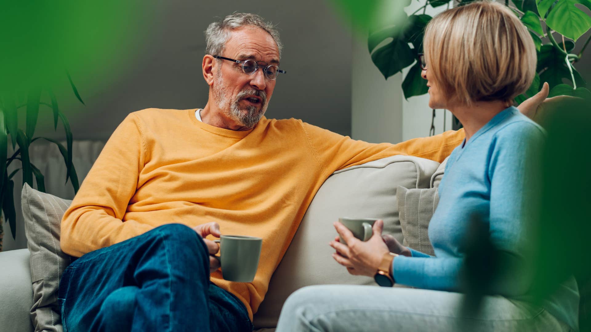 Couple having a serious conversation on a couch