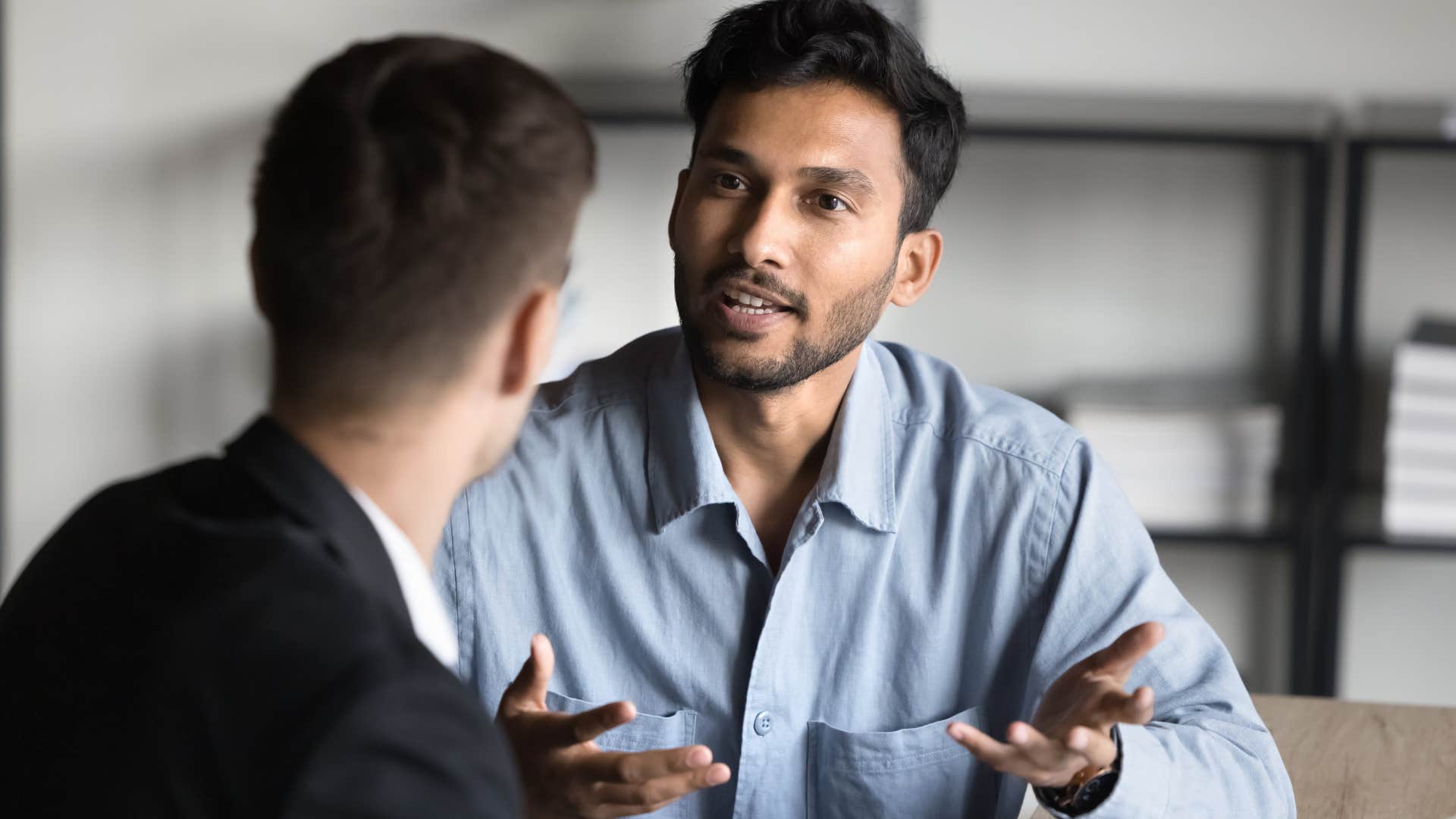 Co-workers talking together in an office