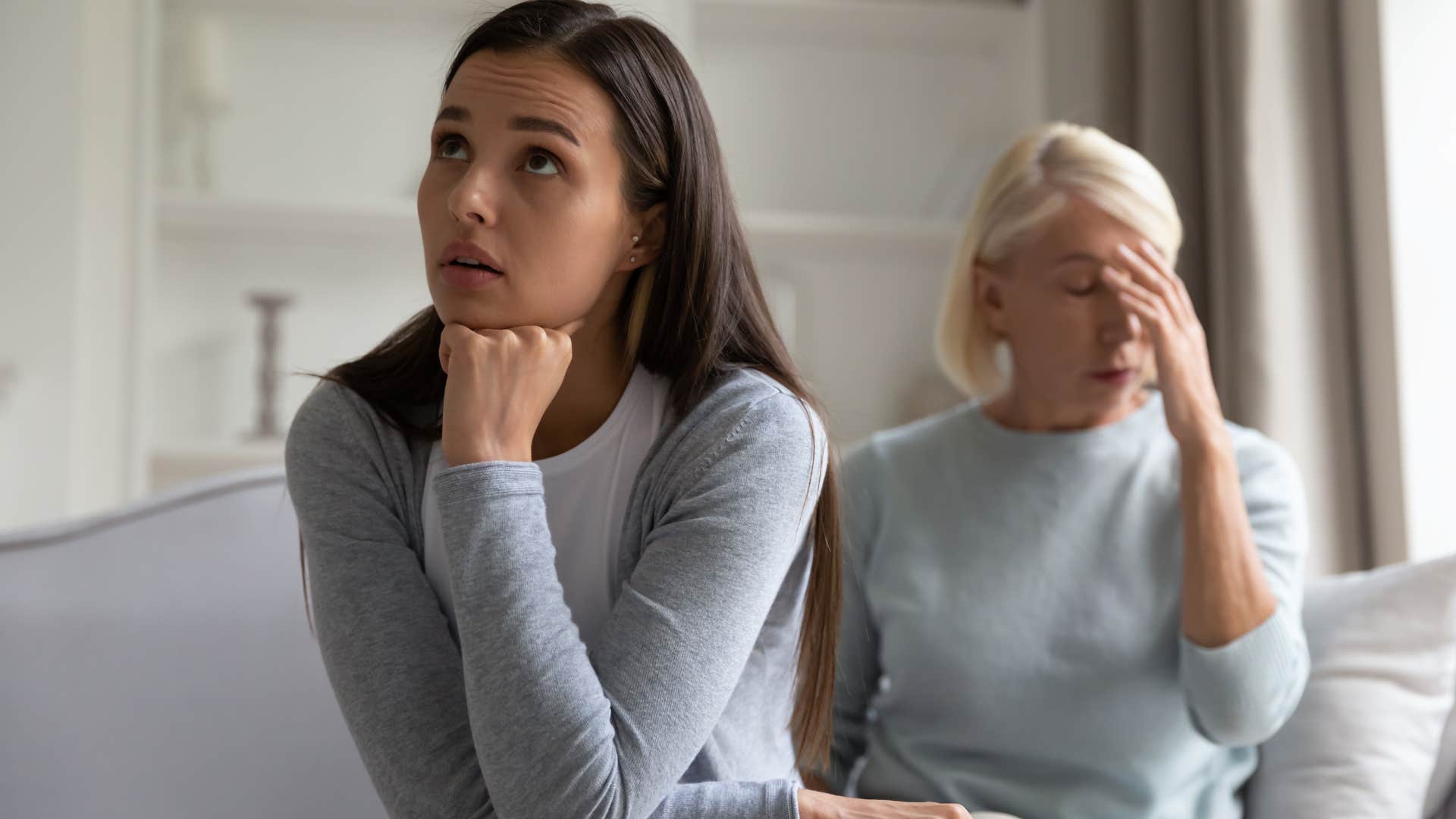 Woman turned away from her upset mother.