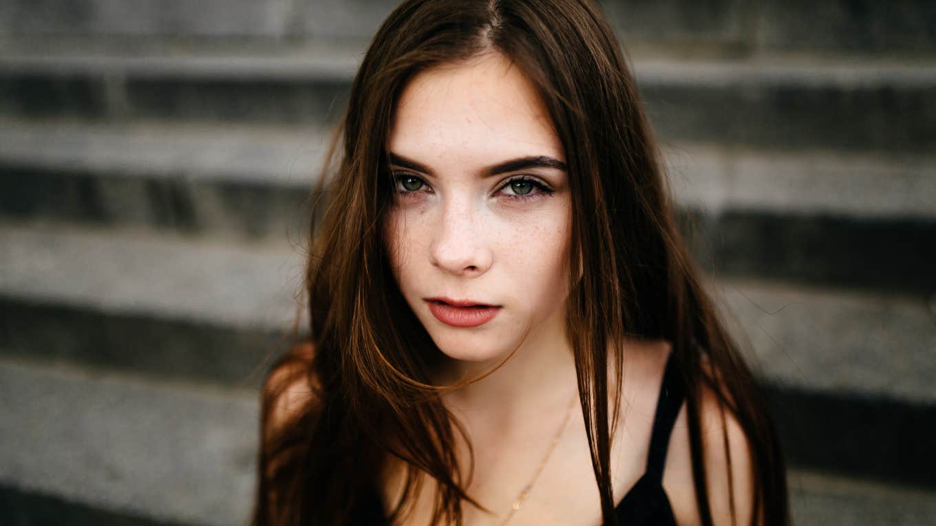 young woman posing on a street in the city