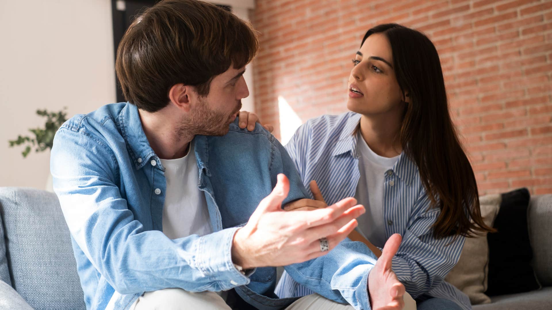 Woman arguing with her partner on the couch