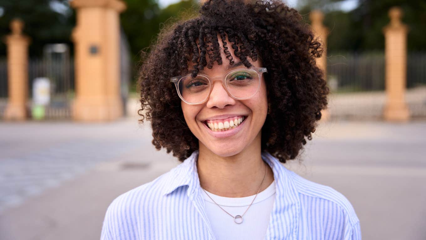 Confident woman smiling at the camera.