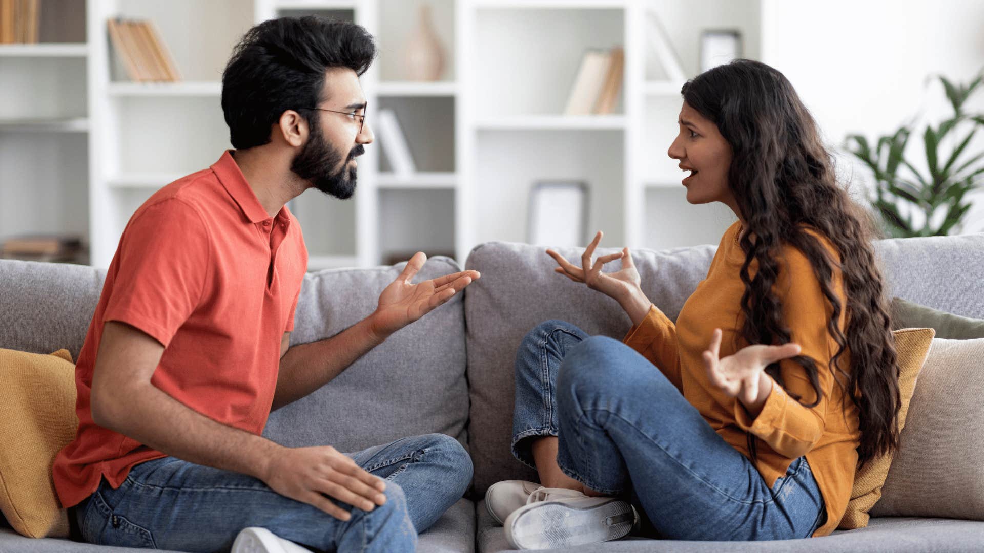 couple arguing on the couch