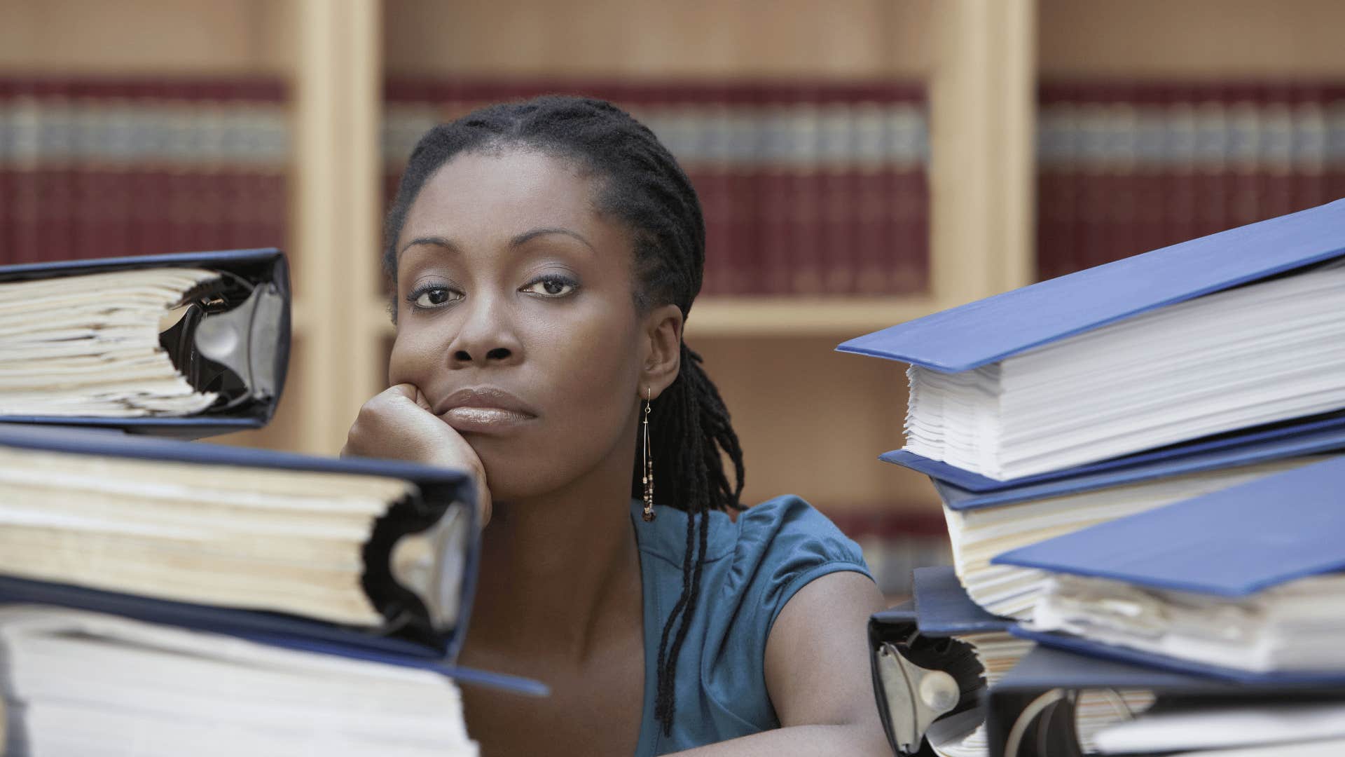 woman surrounded by books