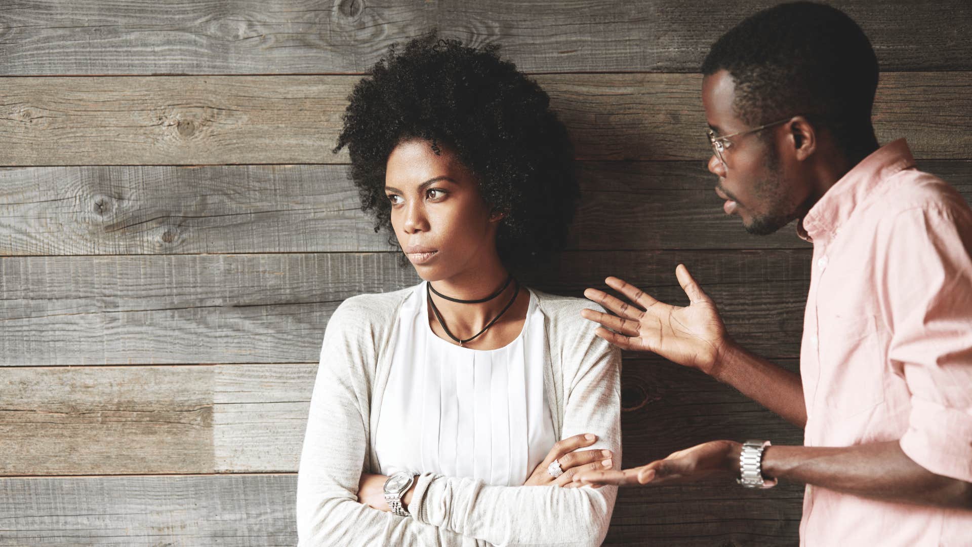 upset woman ignoring a man