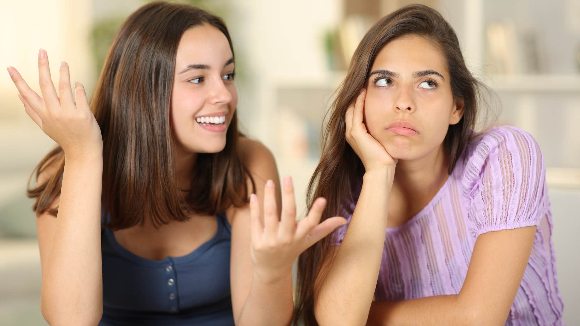 Woman turned away from her friend looking annoyed.