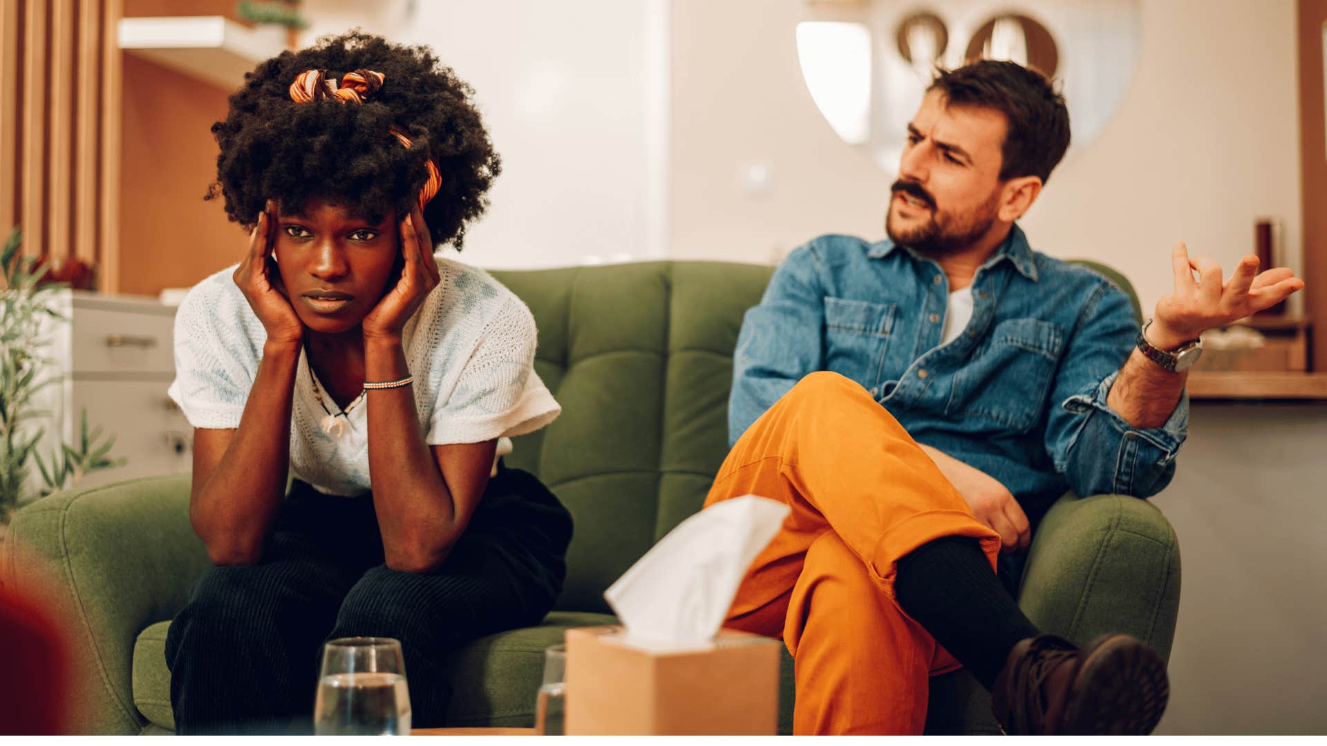 man complaining while woman looks overwhelmed 