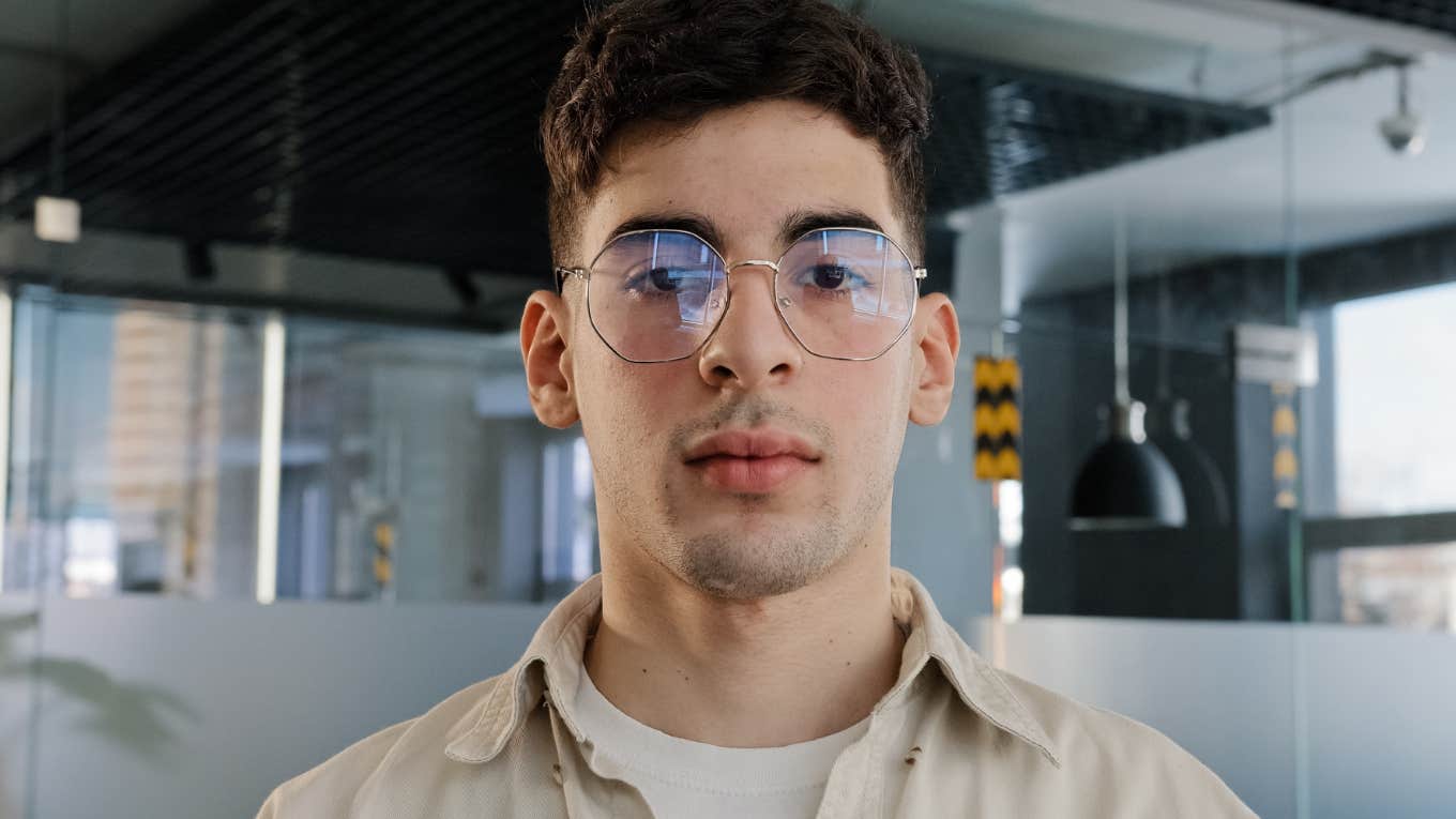 man wearing glasses looking serious