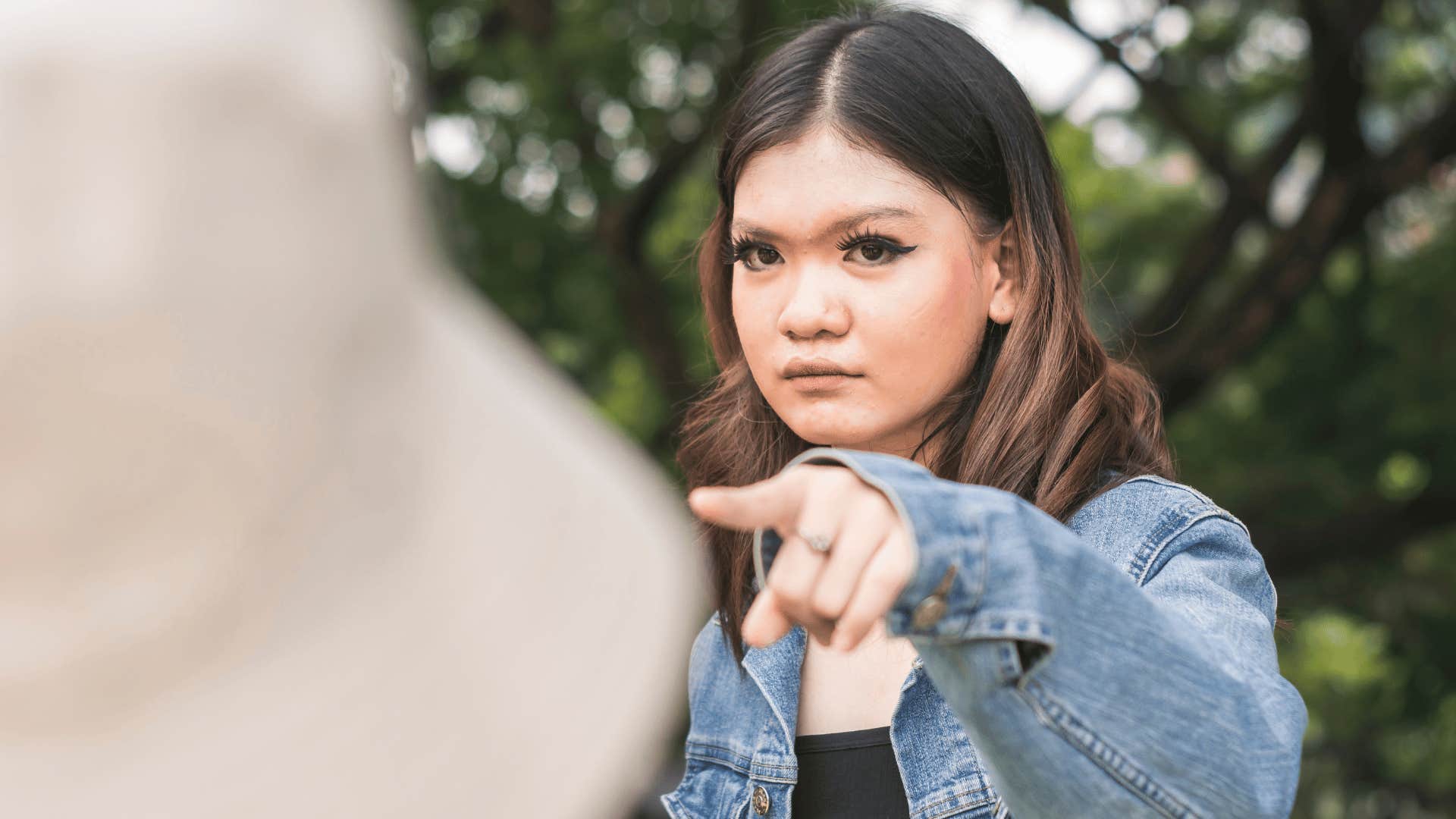 Woman points her finger in blame