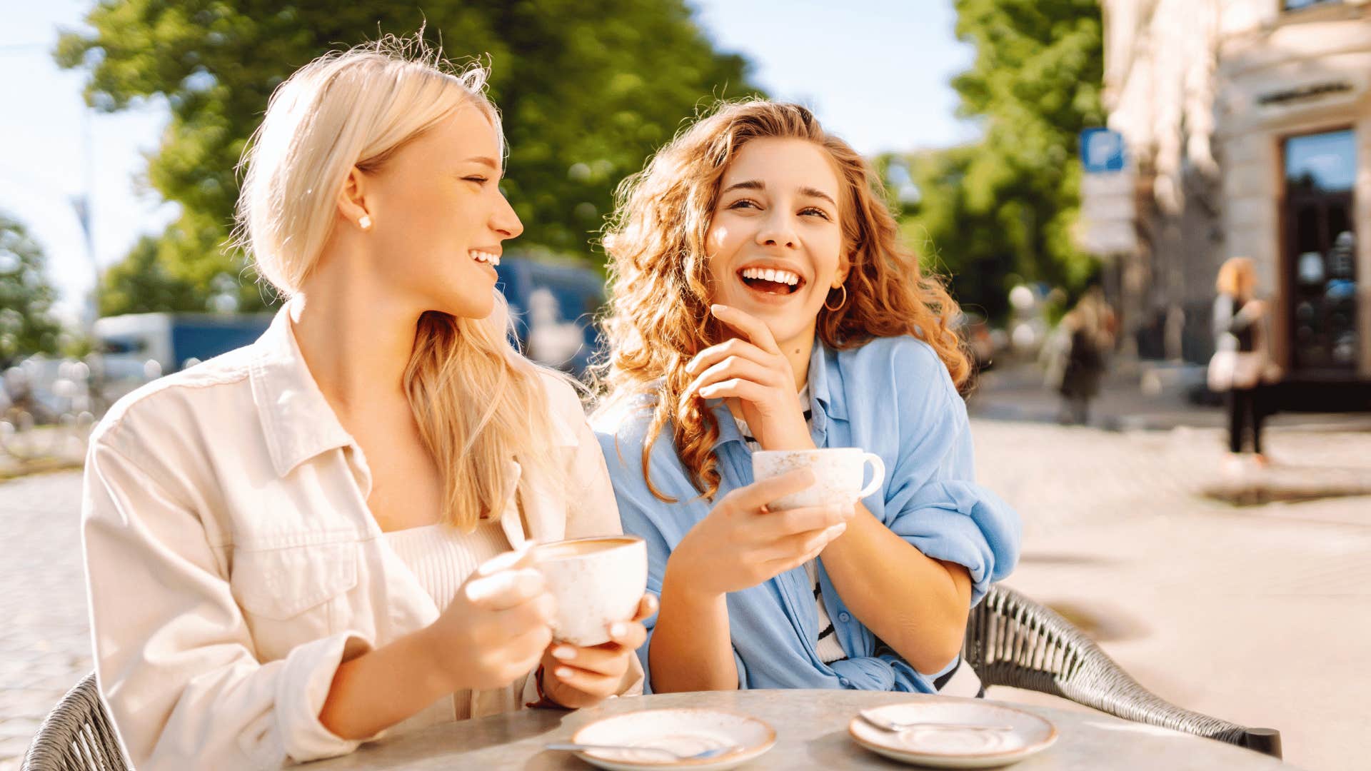 friends laughing and drinking coffee